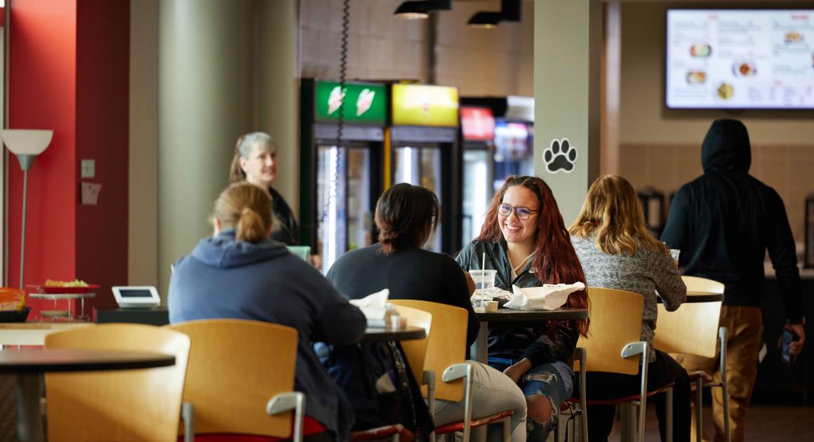 Students eating at The Den dining place on the W.A. Lettinga campus 